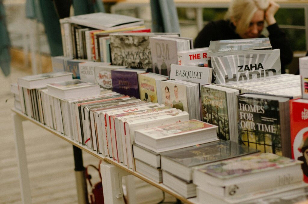 A table with an open book resting on it.